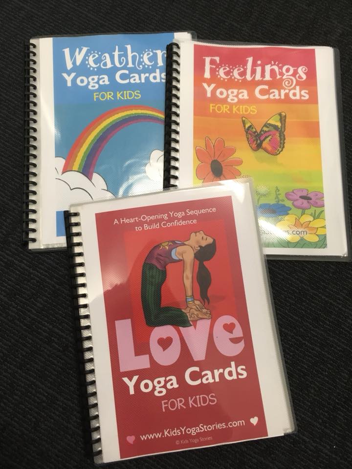 Digital yoga cards printed out and put into plastic pocket display books for easy reference | Kids Yoga Stories